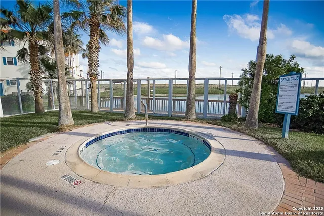 a view of swimming pool with a yard