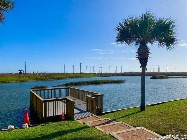 a view of a swimming pool with a yard