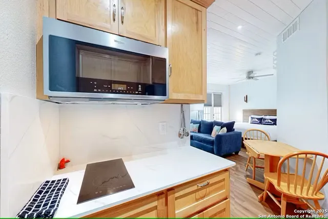 a kitchen with a cabinets and appliances