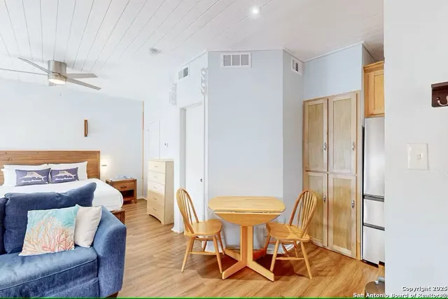 a view of a livingroom with furniture and a table
