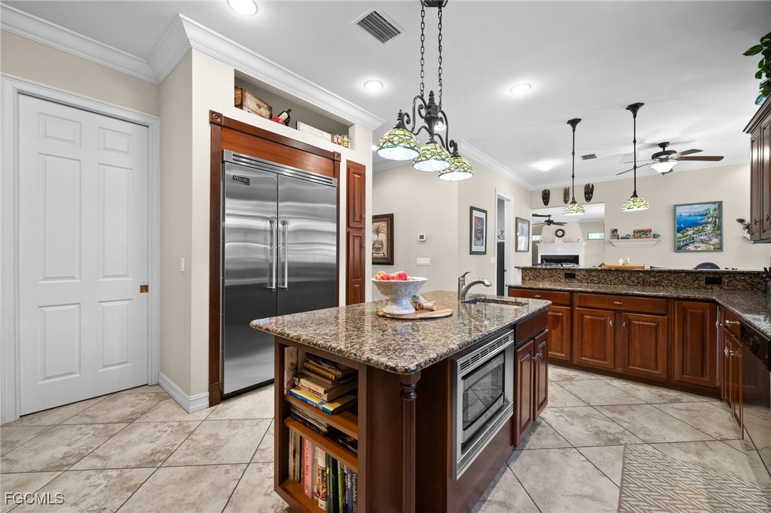 13350 Shetland Lane Fort Myers, FL 33912 - Photo 17 of 49 a kitchen with stainless steel appliances granite countertop a sink and a refrigerator