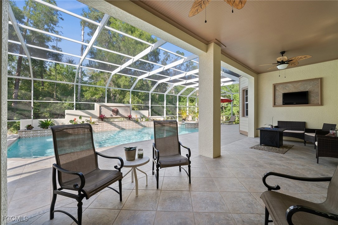 13350 Shetland Lane Fort Myers, FL 33912 - Photo 25 of 49 a outdoor living space with furniture a flat screen tv and a window