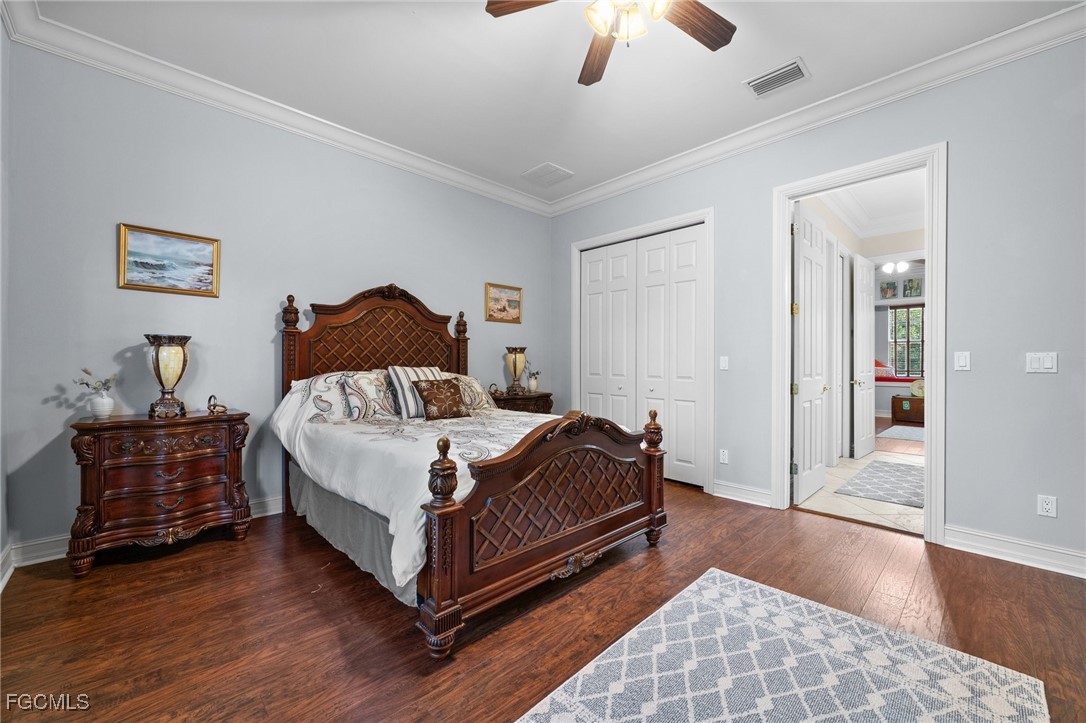 13350 Shetland Lane Fort Myers, FL 33912 - Photo 39 of 49 a bed room with a bed and a chandelier