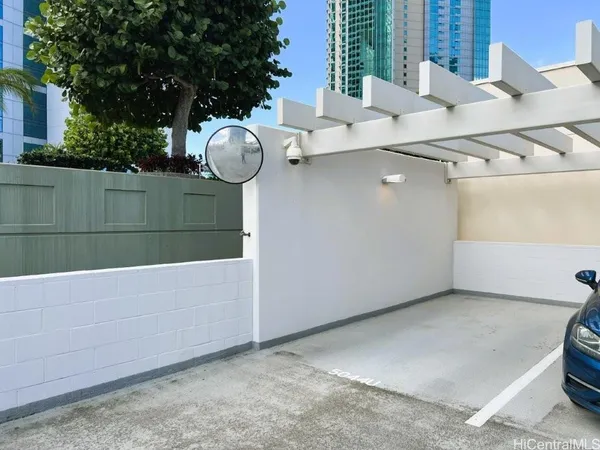 a view of a chairs and table in the backyard