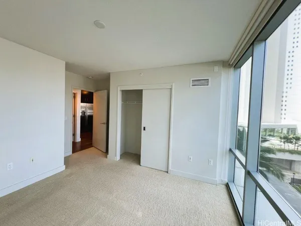 a bathroom with a granite countertop sink mirror vanity and bathtub
