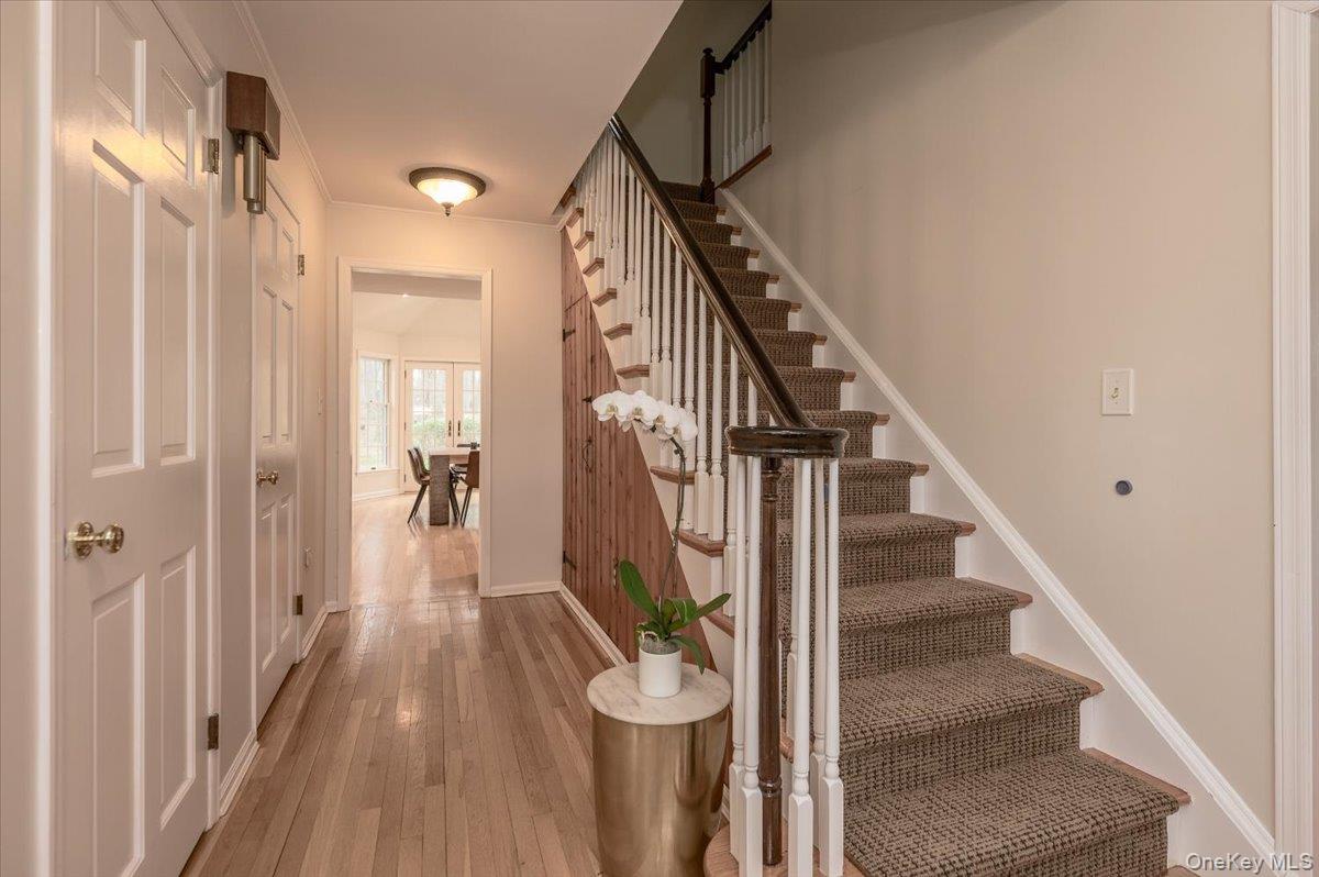 4 Springwood Path Syosset, NY 11791 - Photo 19 of 47 Hardwood flooring, wood staircase and entry guest closets.