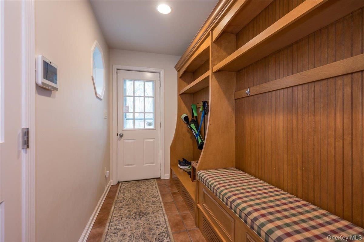 4 Springwood Path Syosset, NY 11791 - Photo 32 of 47 Beautiful built-in storage cabinetry for organization and entry to side patio.