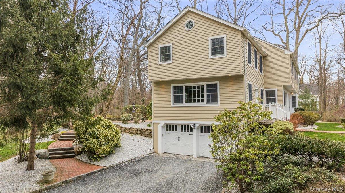 4 Springwood Path Syosset, NY 11791 - Photo 45 of 47 Two car garage with large driveway for additional parking.