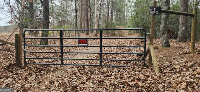a view of a wooden fence and a window