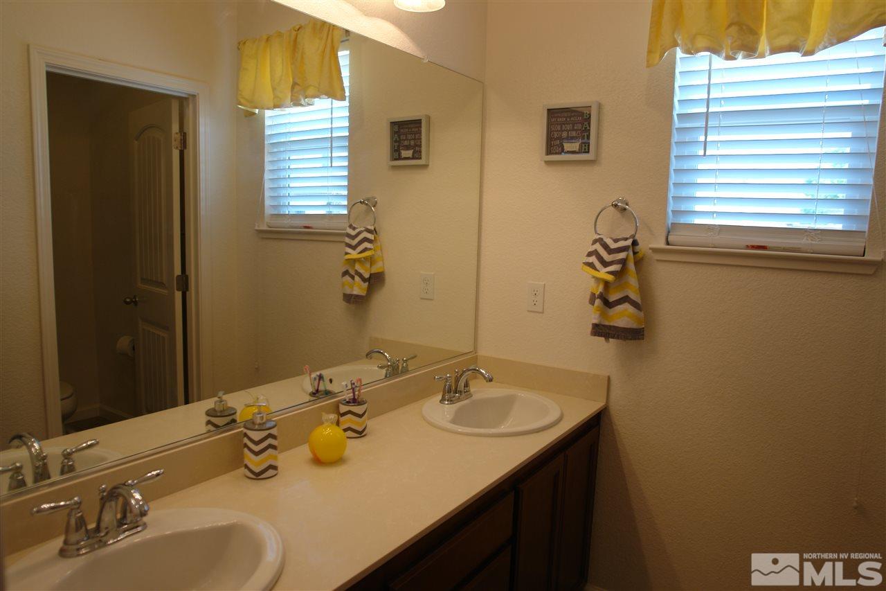 1975 Tawleed Road Reno, NV 89521 - Photo 17 of 18 a bathroom with a sink and a mirror