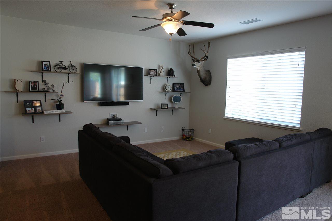 1975 Tawleed Road Reno, NV 89521 - Photo 3 of 18 a living room with furniture and a flat screen tv