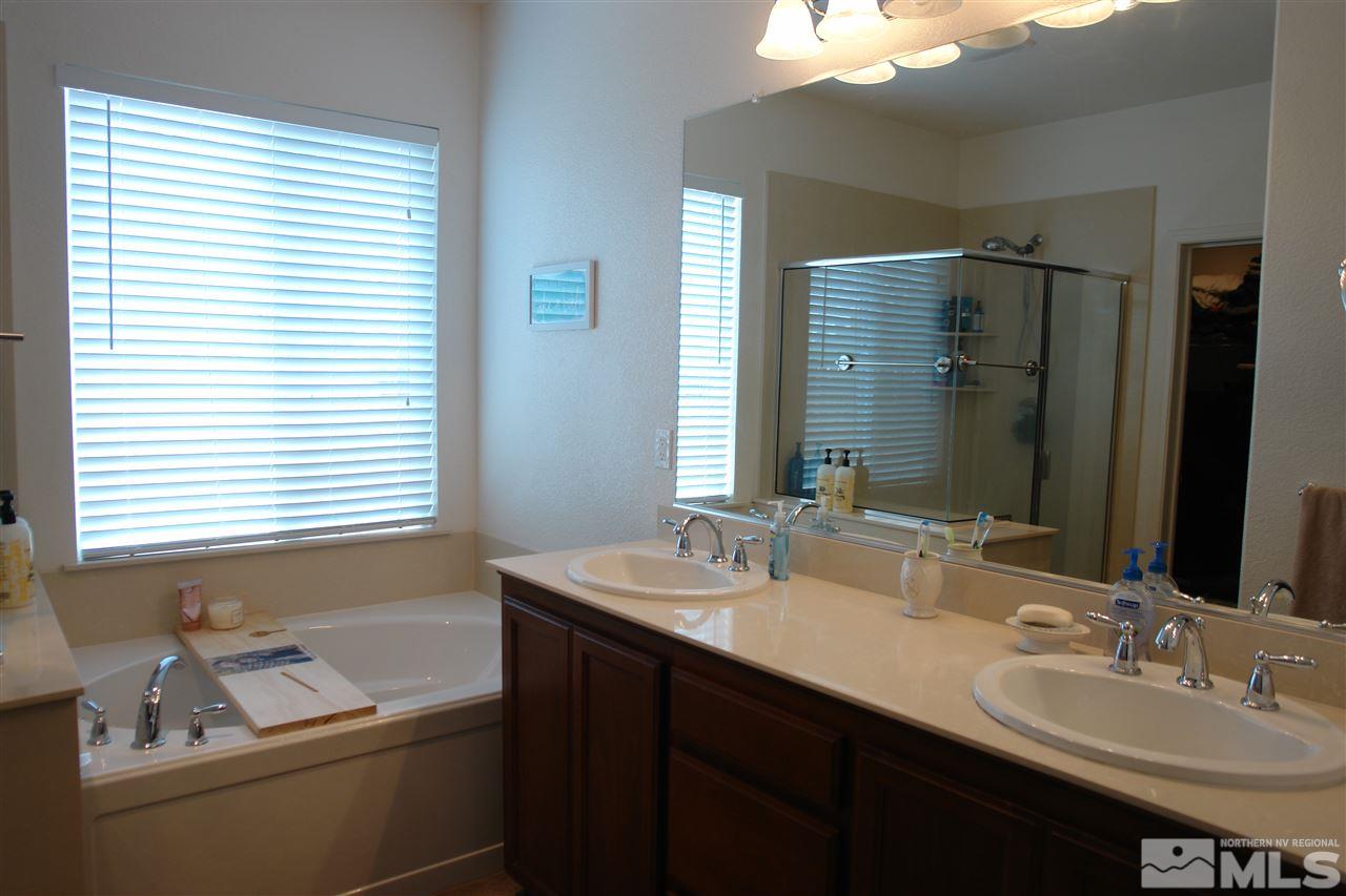 1975 Tawleed Road Reno, NV 89521 - Photo 8 of 18 a bathroom with a double vanity sink and a mirror