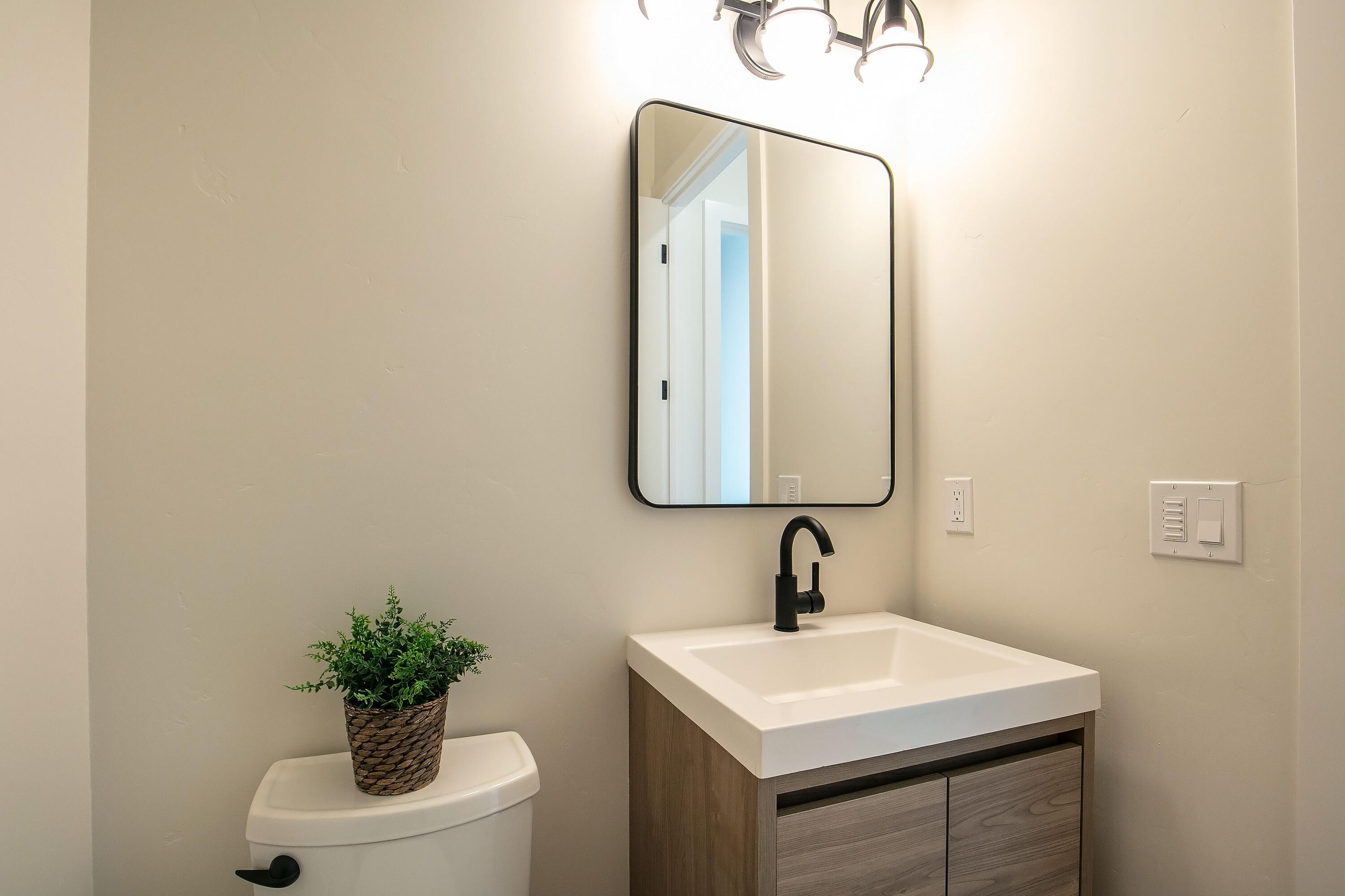 19550 Buck Canyon Road Bend, OR 97702 - Photo 16 of 28 a bathroom with a sink vanity and a mirror