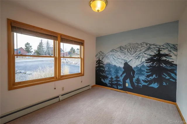 a view of a bedroom with a large window