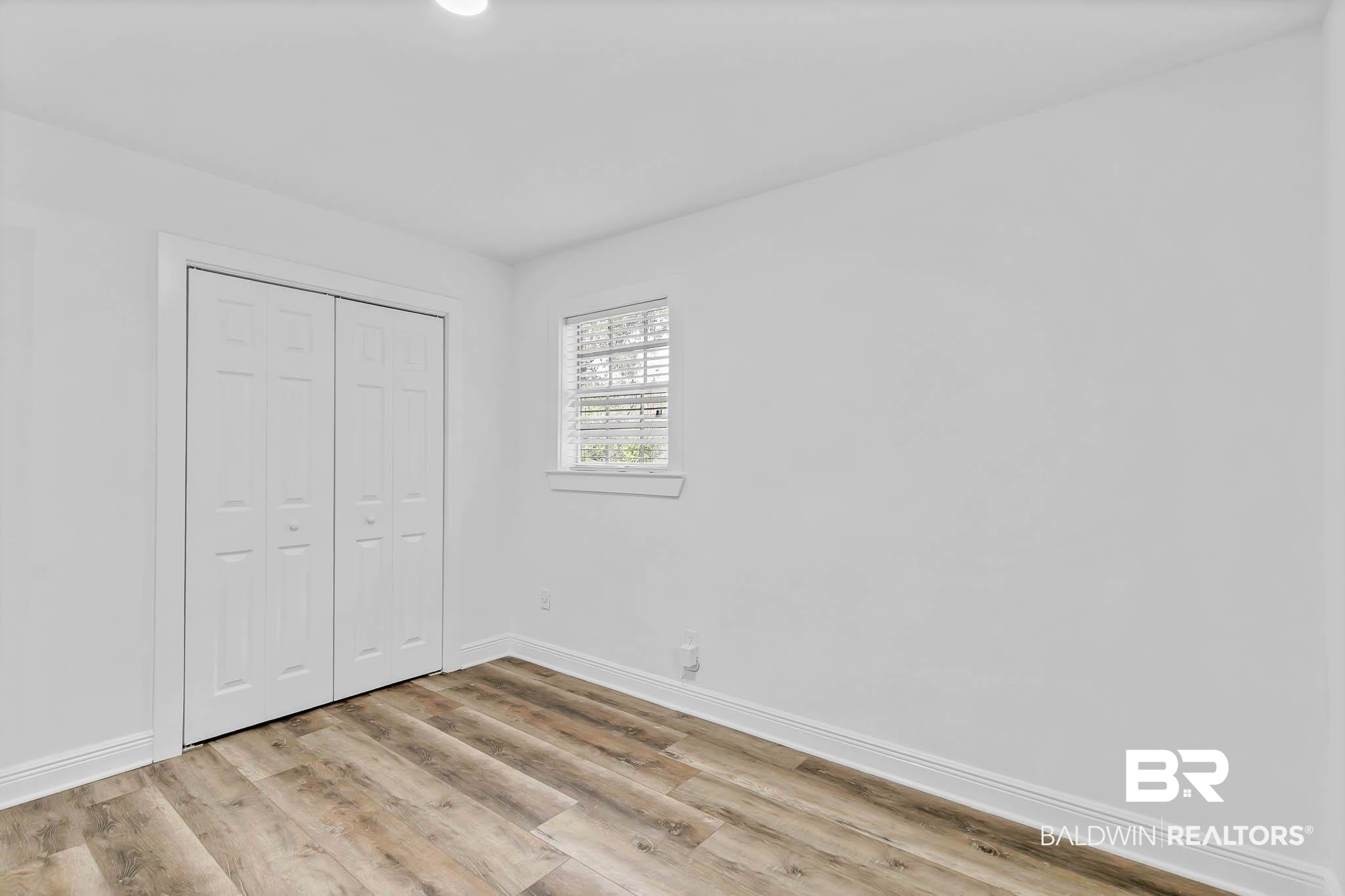 4705 Sherry Court Mobile, AL 36693 - Photo 51 of 100 Unfurnished bedroom featuring light wood finished floors and a closet