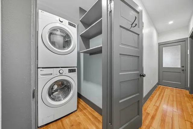 a view of a hallway with washer and dryer