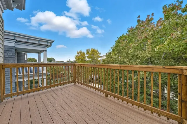 a view of balcony with wooden floor