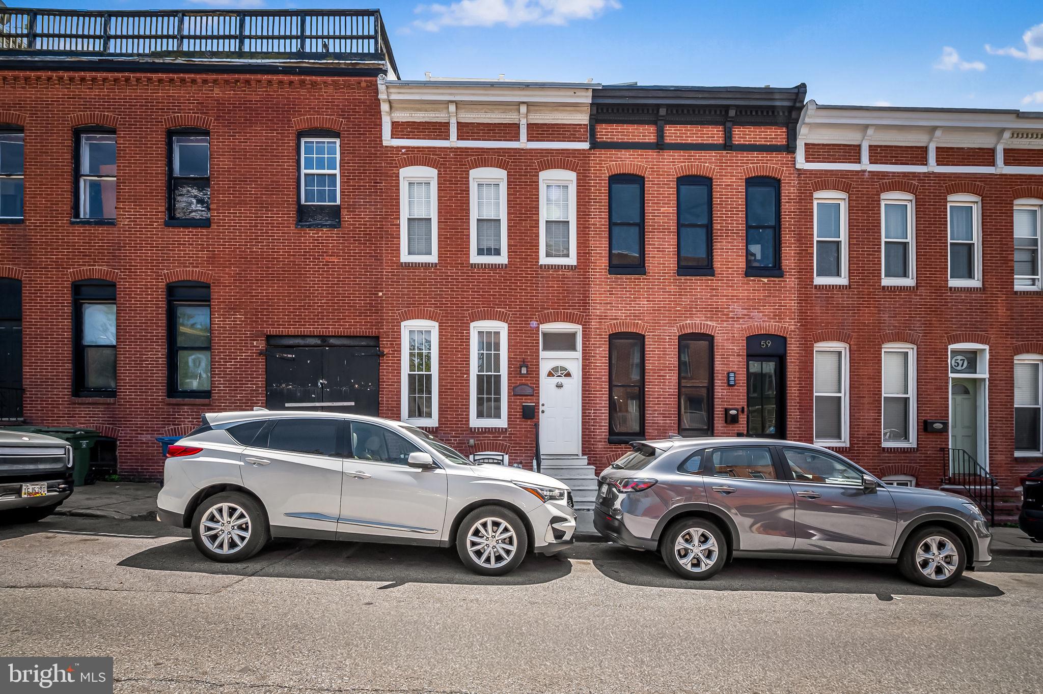 61 East Heath Street Baltimore, MD 21230 - Photo 1 of 30 a car parked in front of a building