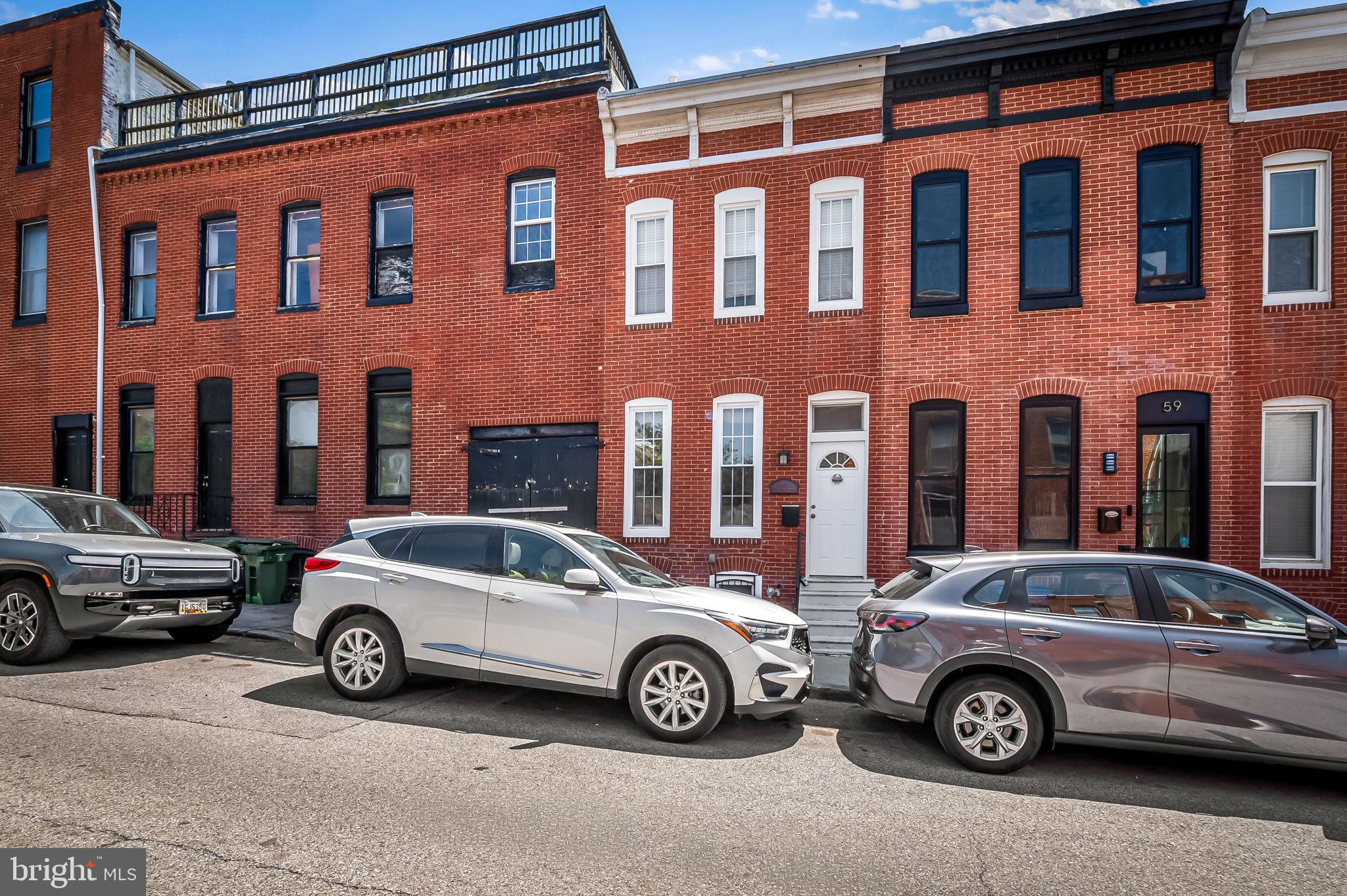 61 East Heath Street Baltimore, MD 21230 - Photo 2 of 30 a car parked in front of a building