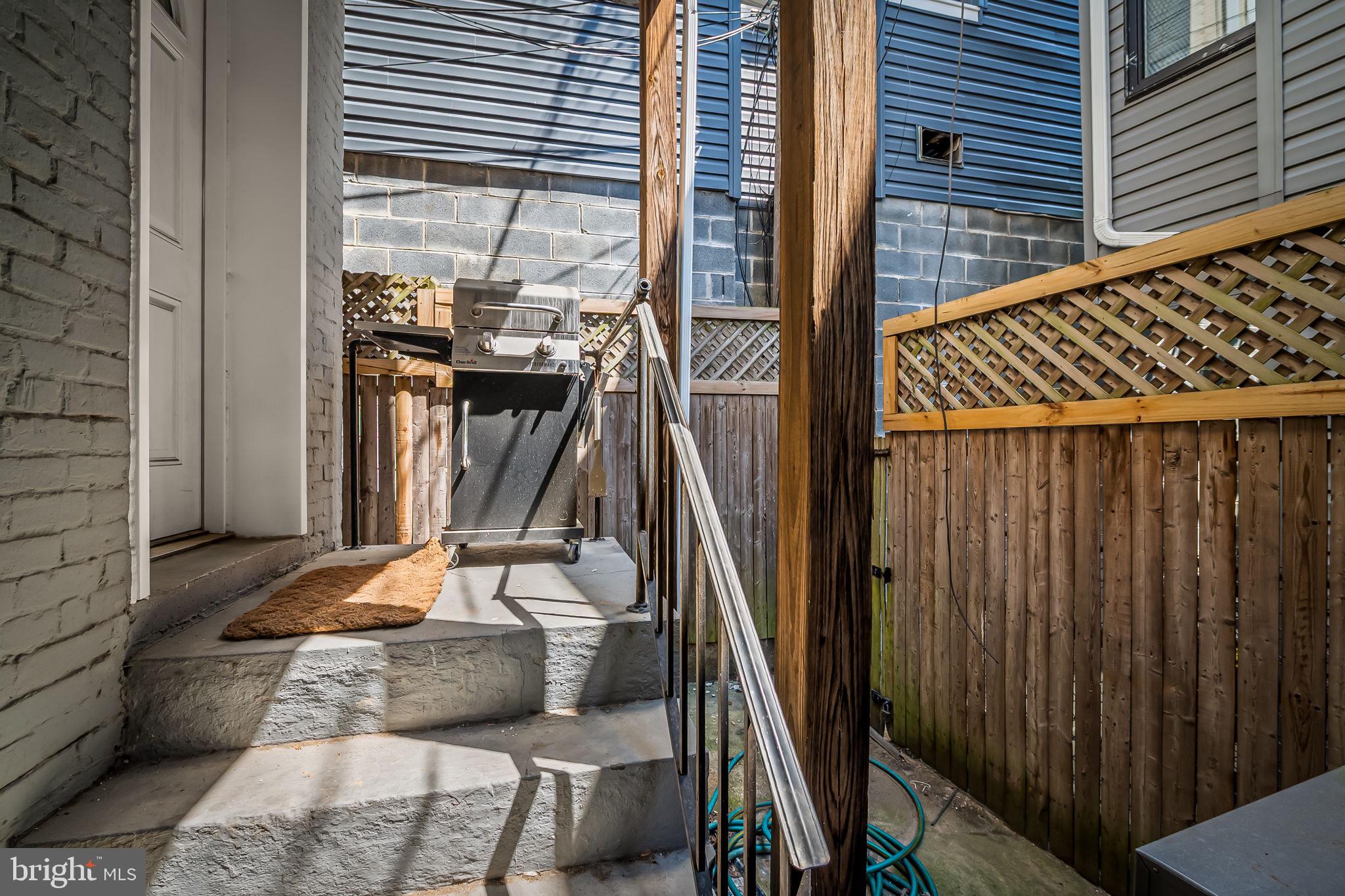 61 East Heath Street Baltimore, MD 21230 - Photo 30 of 30 a view of balcony with wooden floor and outdoor seating