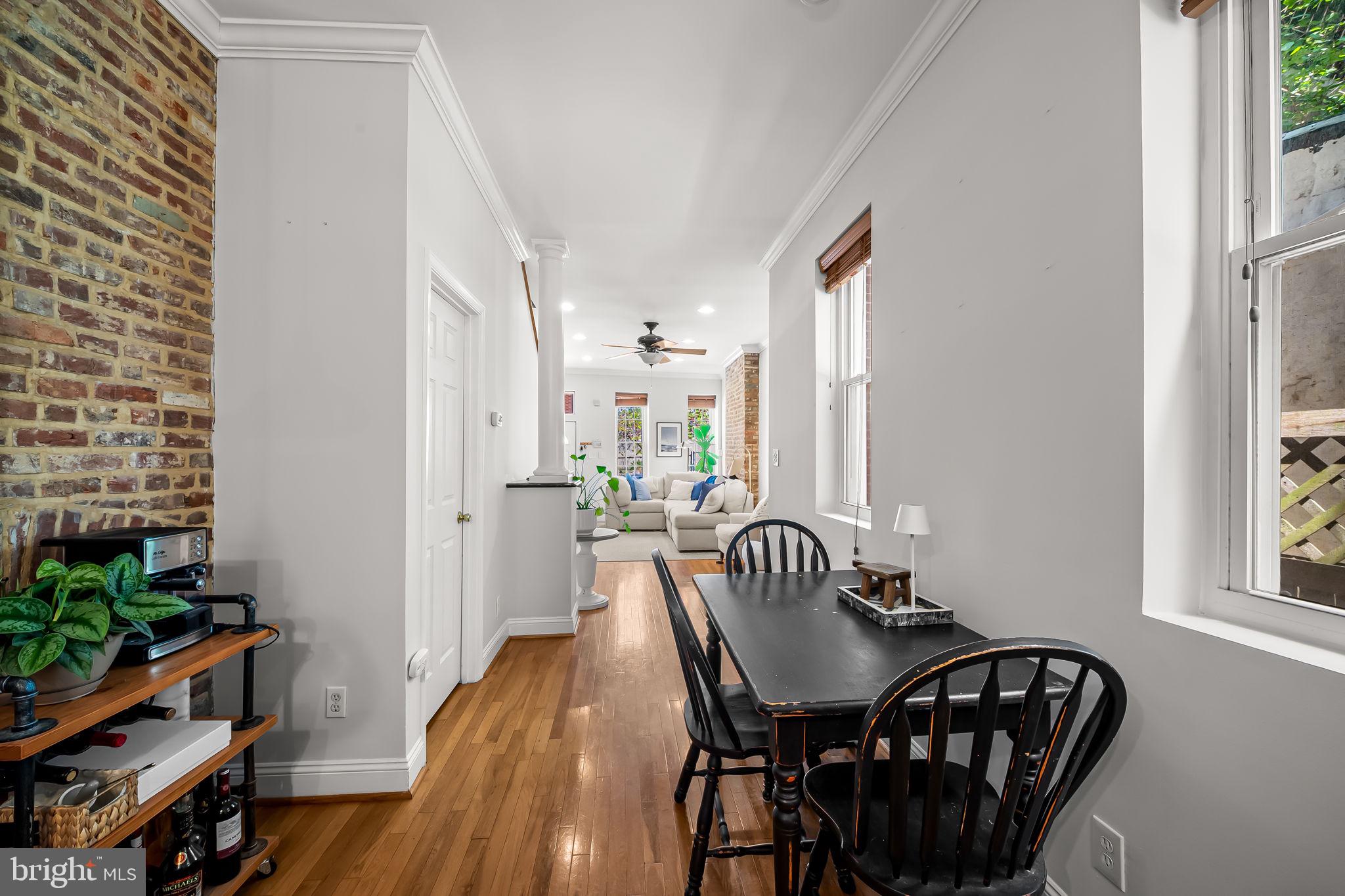 61 East Heath Street Baltimore, MD 21230 - Photo 8 of 30 a view of a dining room with furniture and wooden floor