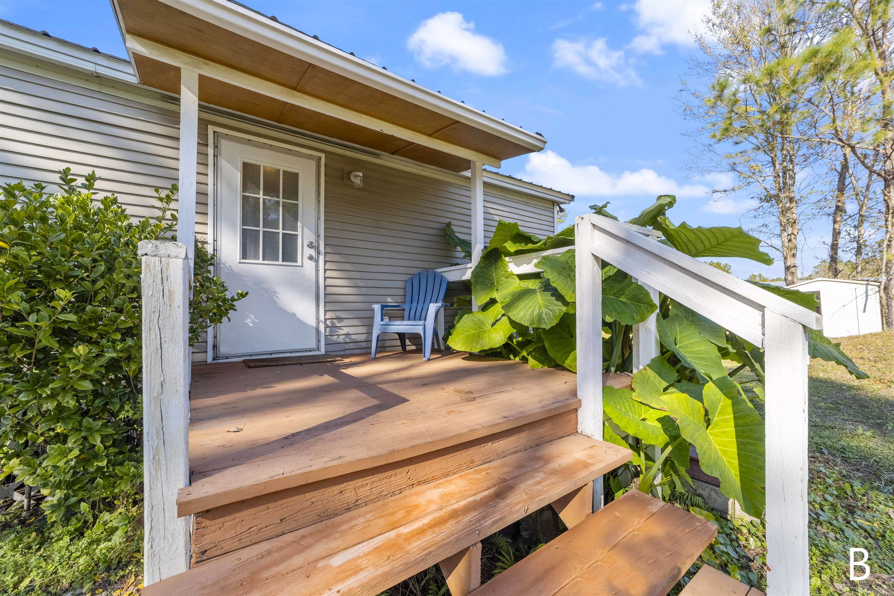 2905 County Road 214, Unit D St. Augustine, FL 32084 - Photo 11 of 46 a view of a porch with a bench in patio