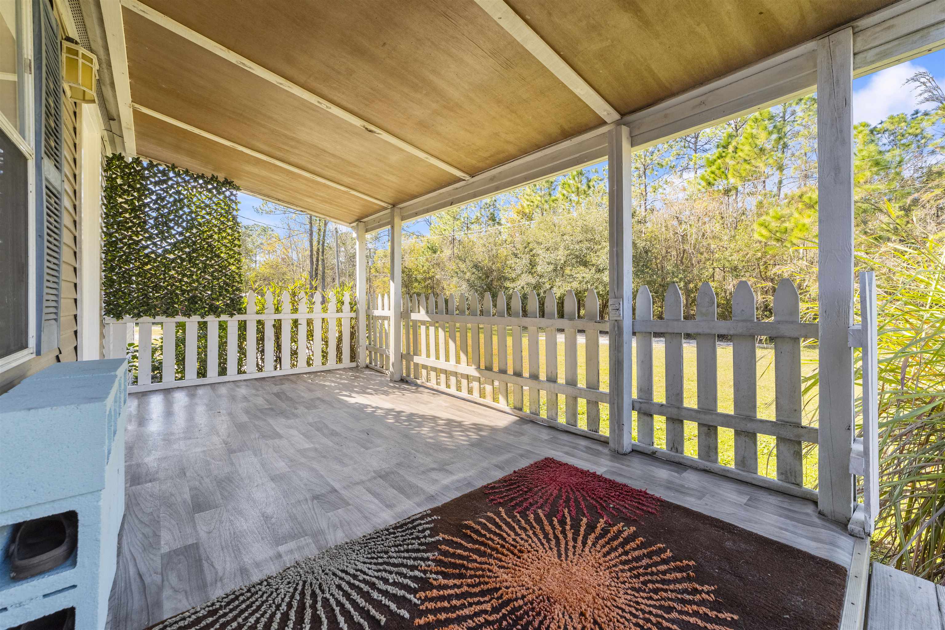 2905 County Road 214, Unit D St. Augustine, FL 32084 - Photo 2 of 46 a view of a room with wooden floor and a floor to ceiling window