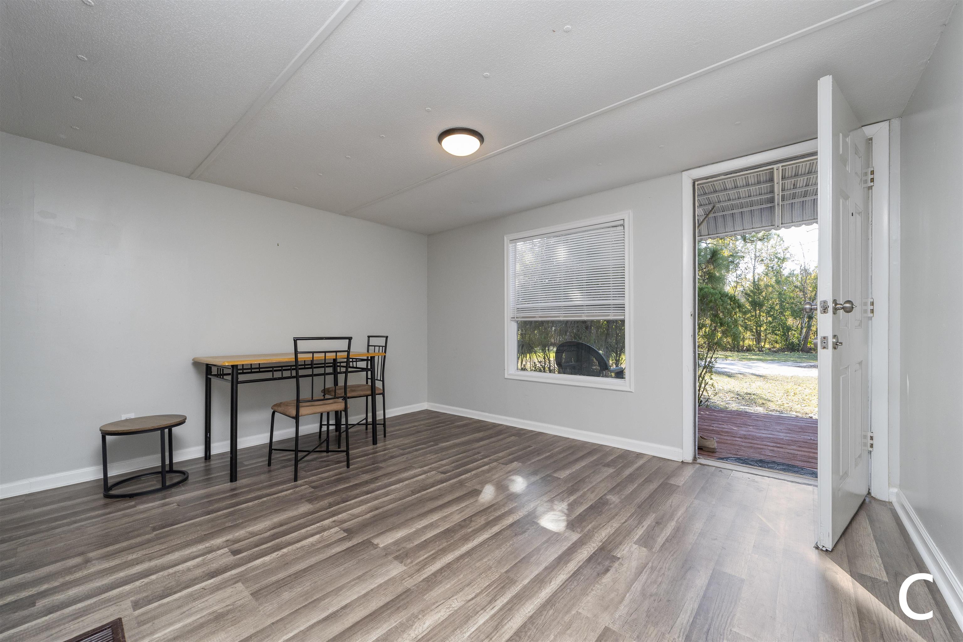 2905 County Road 214, Unit D St. Augustine, FL 32084 - Photo 26 of 46 a view of livingroom with furniture window and front door