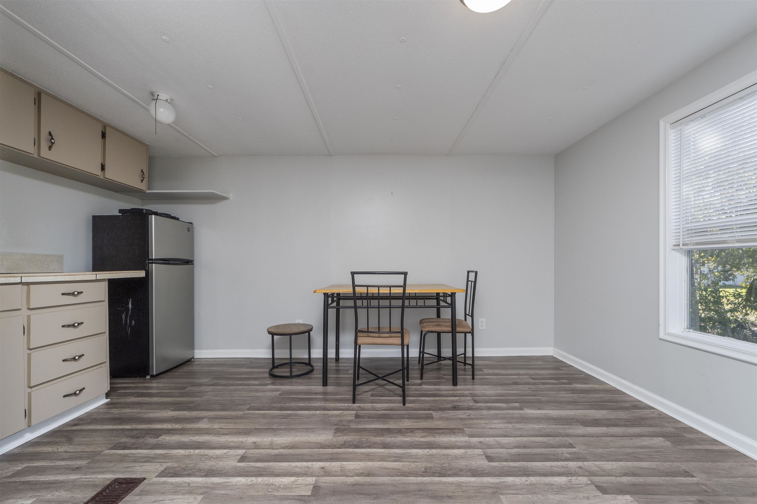 2905 County Road 214, Unit D St. Augustine, FL 32084 - Photo 29 of 46 a view of a dining room with furniture and wooden floor