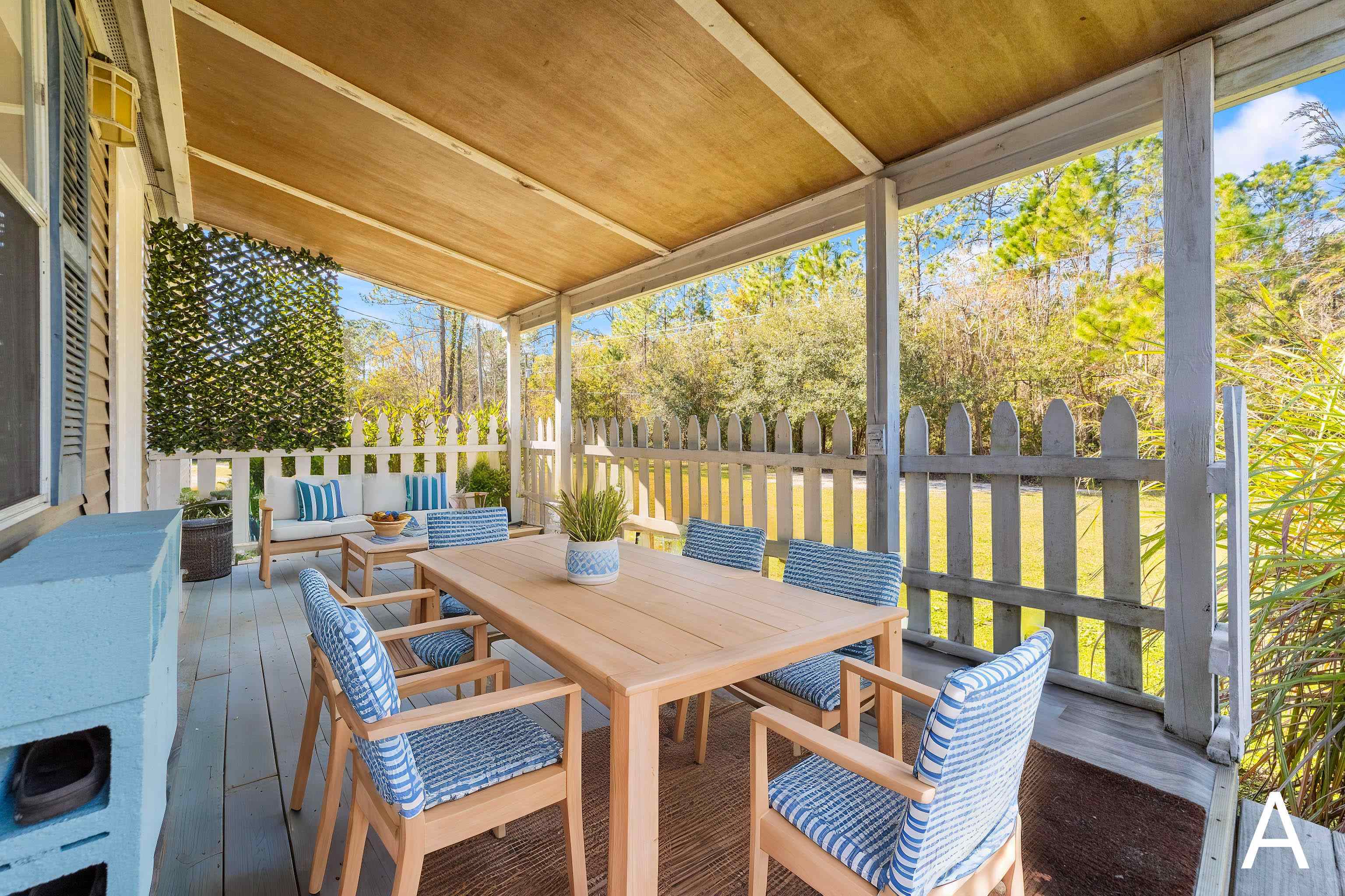 2905 County Road 214, Unit D St. Augustine, FL 32084 - Photo 3 of 46 a view of a dining room with furniture large windows and wooden floor
