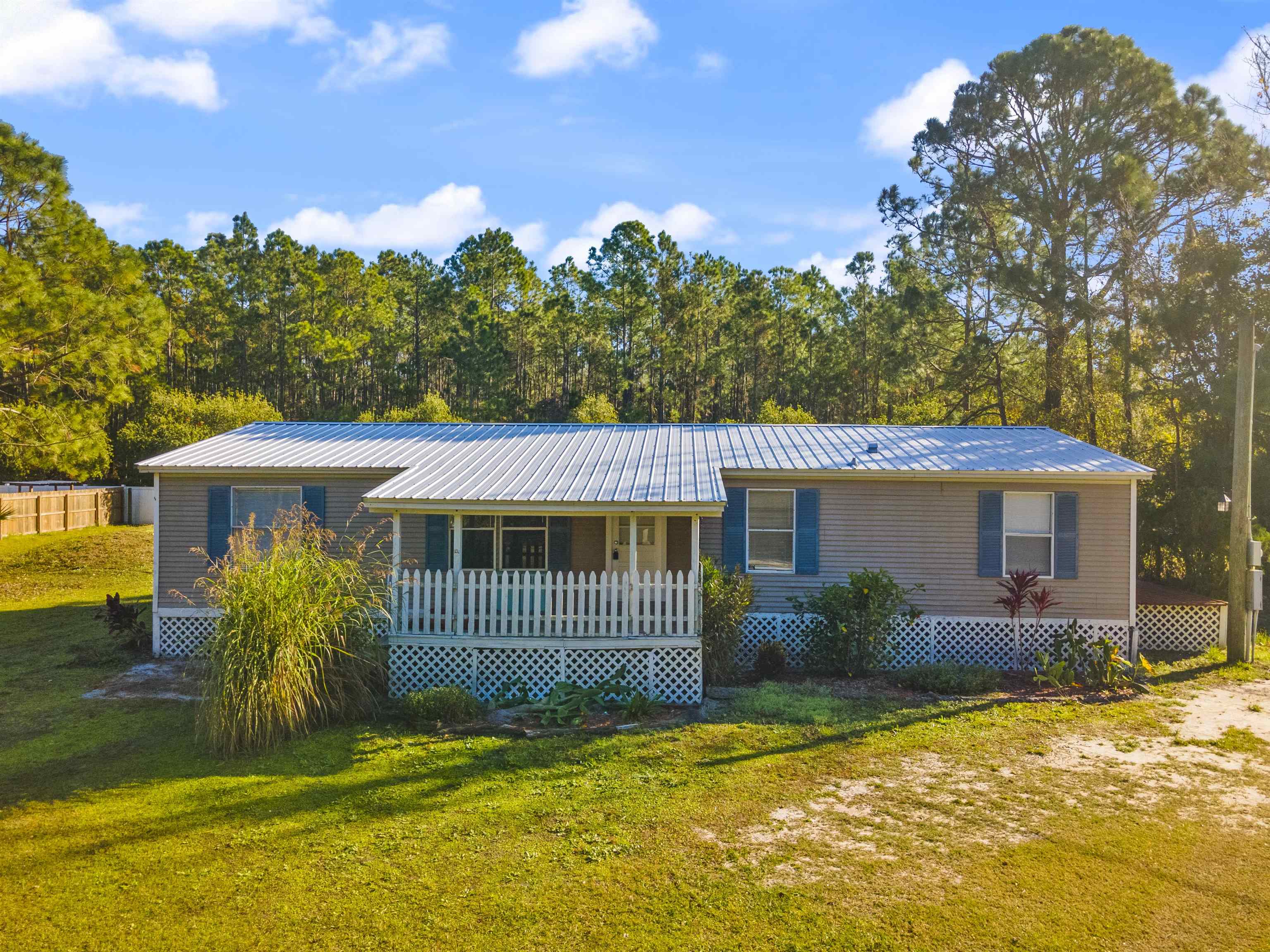 2905 County Road 214, Unit D St. Augustine, FL 32084 - Photo 35 of 46 a view of a house with a yard
