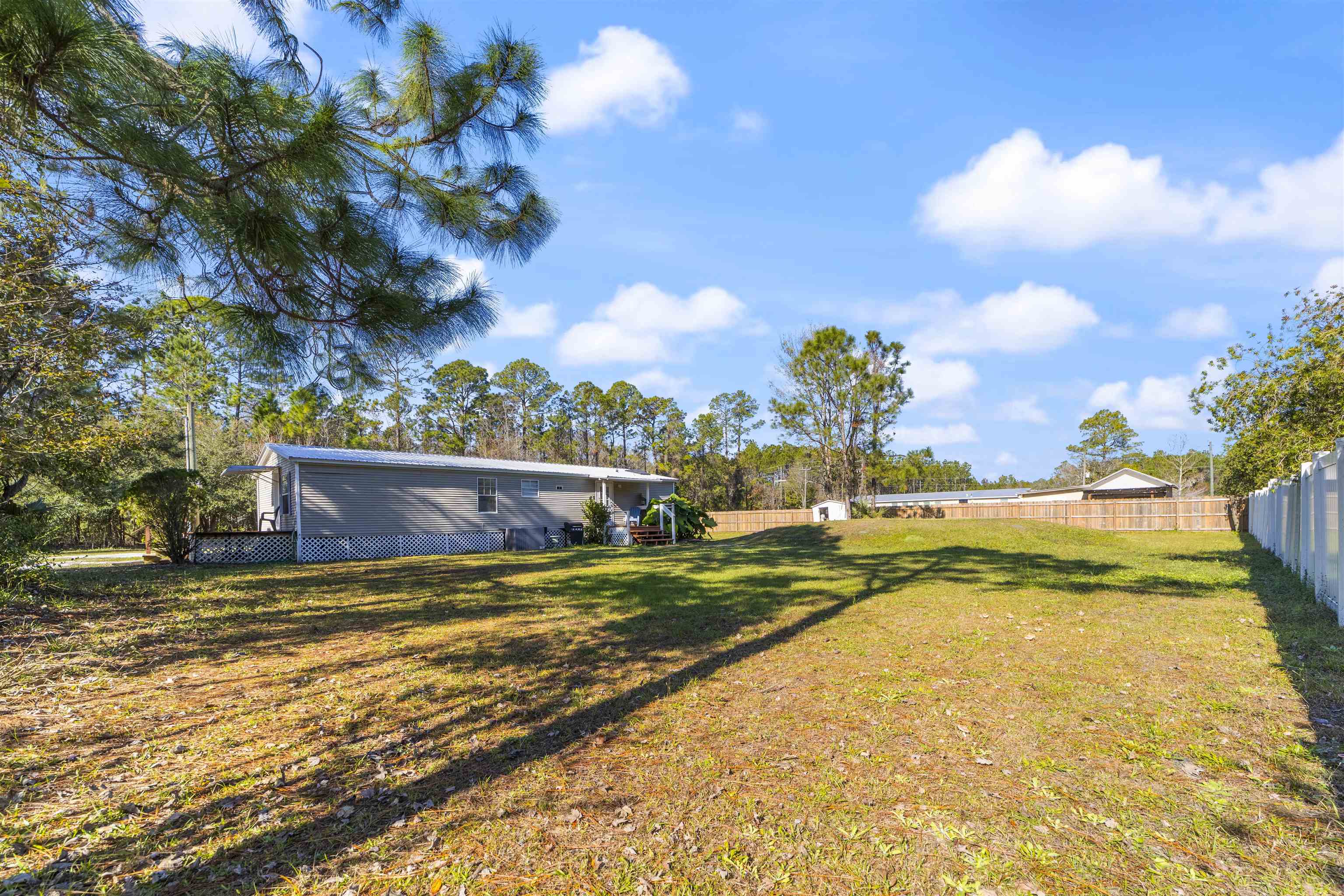 2905 County Road 214, Unit D St. Augustine, FL 32084 - Photo 44 of 46 a view of swimming pool with a yard