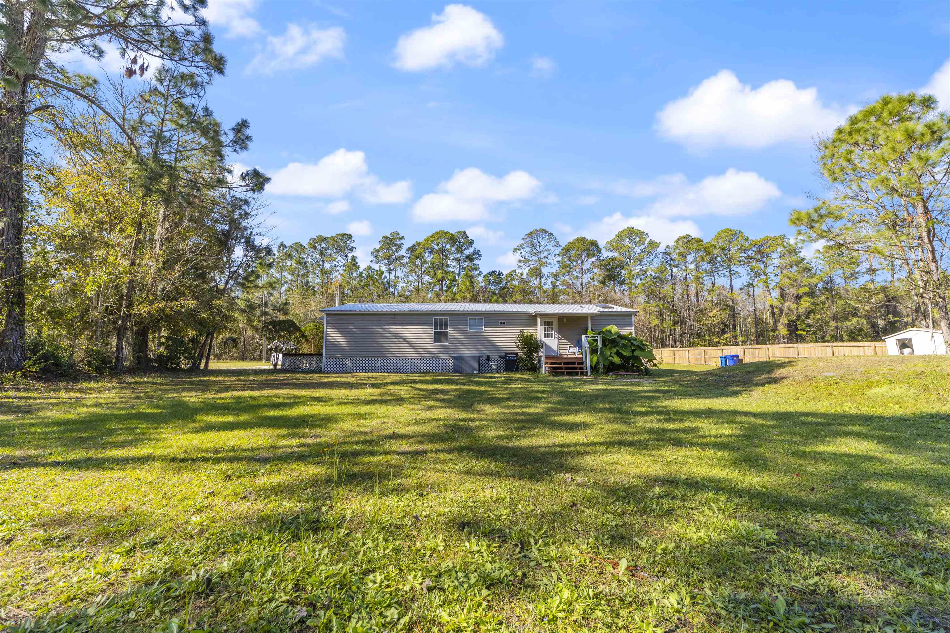 2905 County Road 214, Unit D St. Augustine, FL 32084 - Photo 45 of 46 a view of a house with a yard and swimming pool