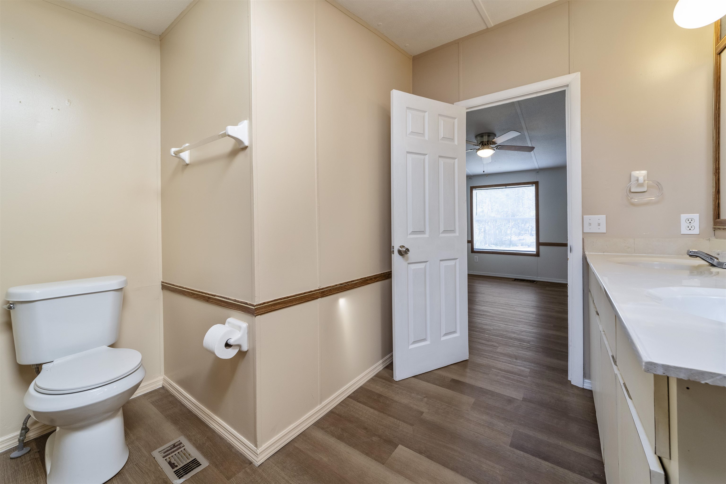2905 County Road 214, Unit D St. Augustine, FL 32084 - Photo 8 of 46 a bathroom with a toilet sink and mirror