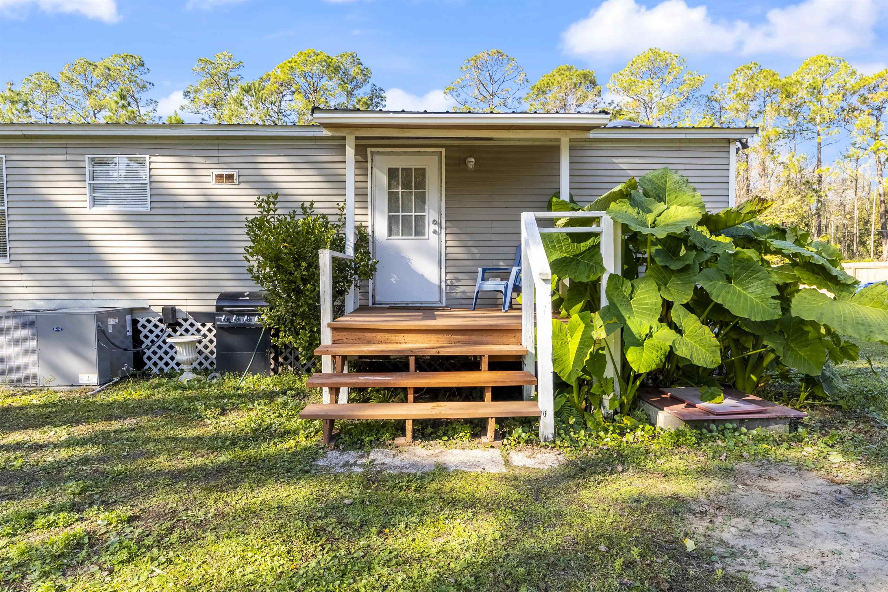 2905 County Road 214, Unit D St. Augustine, FL 32084 - Photo 10 of 46 a view of front of a house with a yard