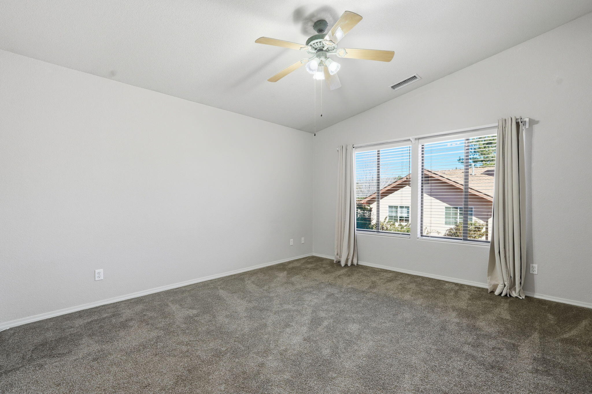 310 North Trailwood Road Payson, AZ 85541 - Photo 25 of 55 an empty room with windows and chandelier fan