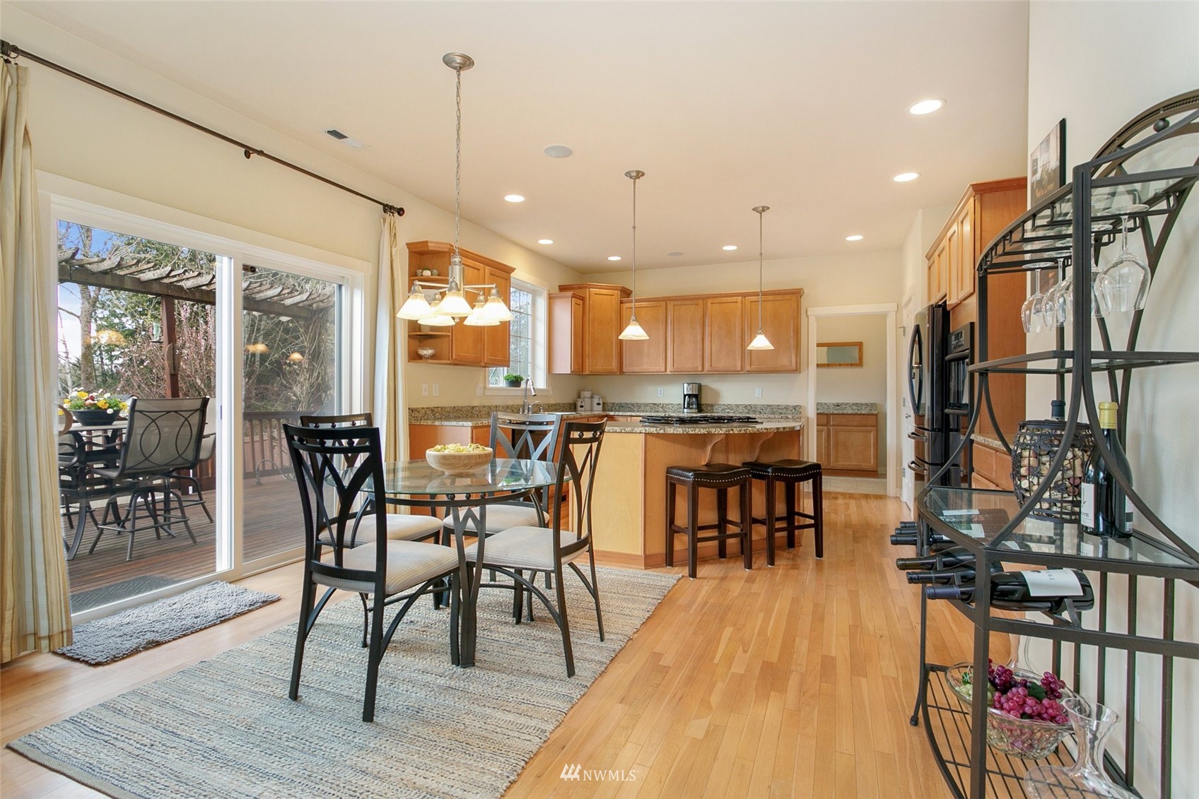 21804 42 Avenue Southeast Bothell, WA 98021 - Photo 12 of 33 a view of a dining room with furniture window and wooden floor