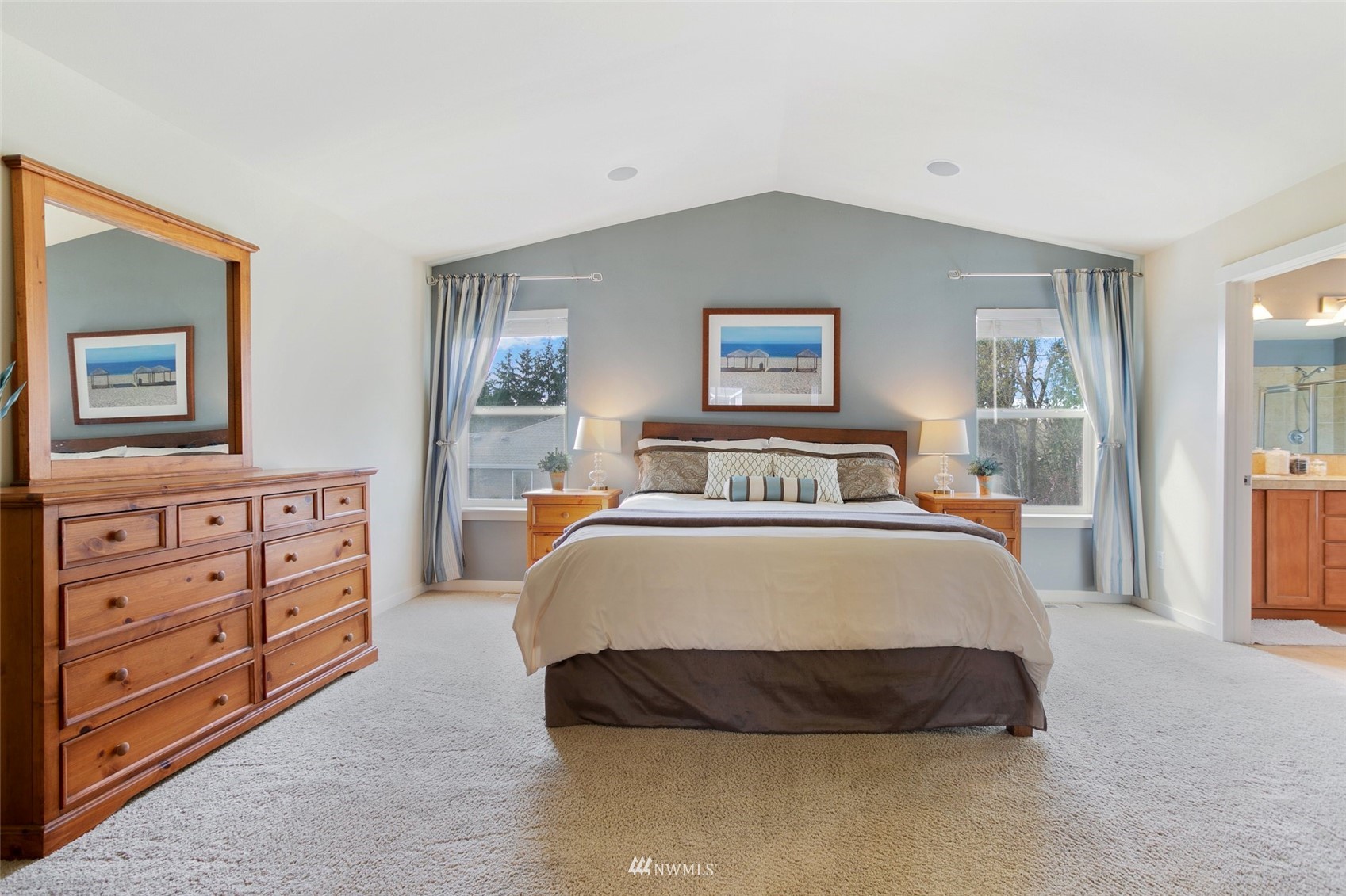21804 42 Avenue Southeast Bothell, WA 98021 - Photo 17 of 33 a spacious bedroom with a bed a dresser and a window