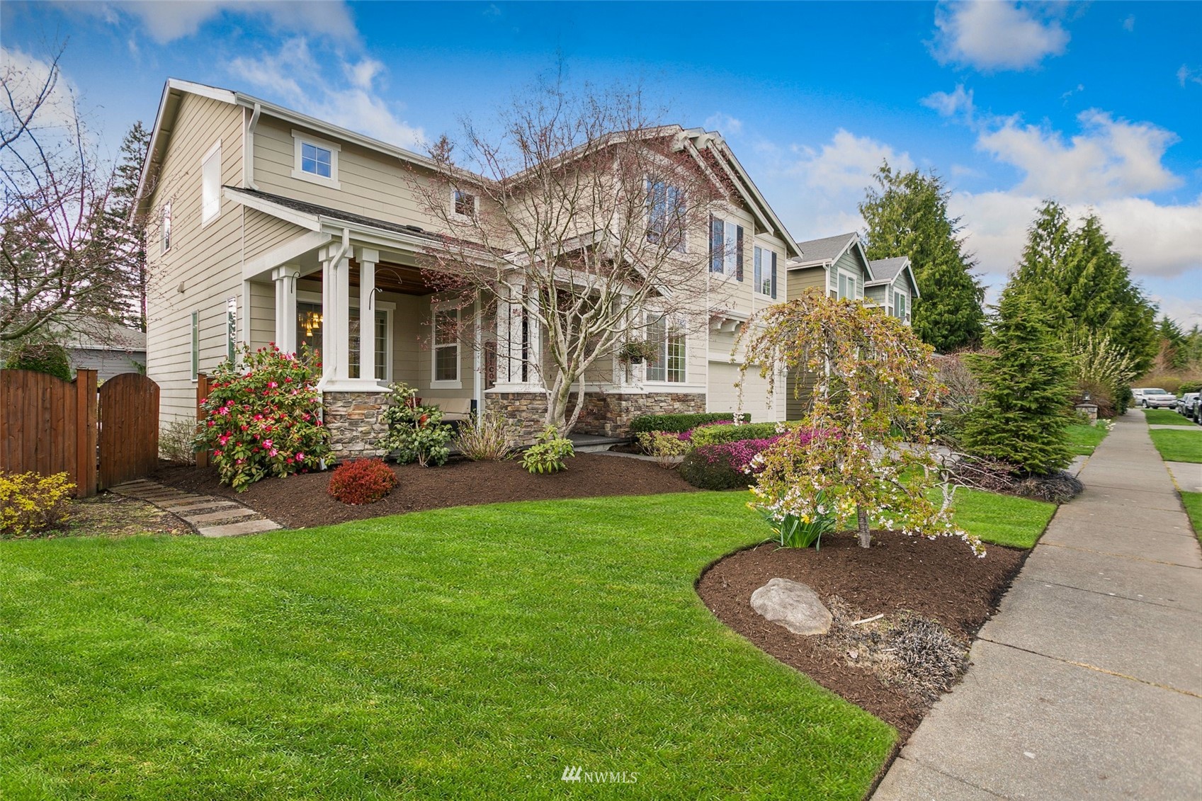 21804 42 Avenue Southeast Bothell, WA 98021 - Photo 2 of 33 a front view of a house with garden