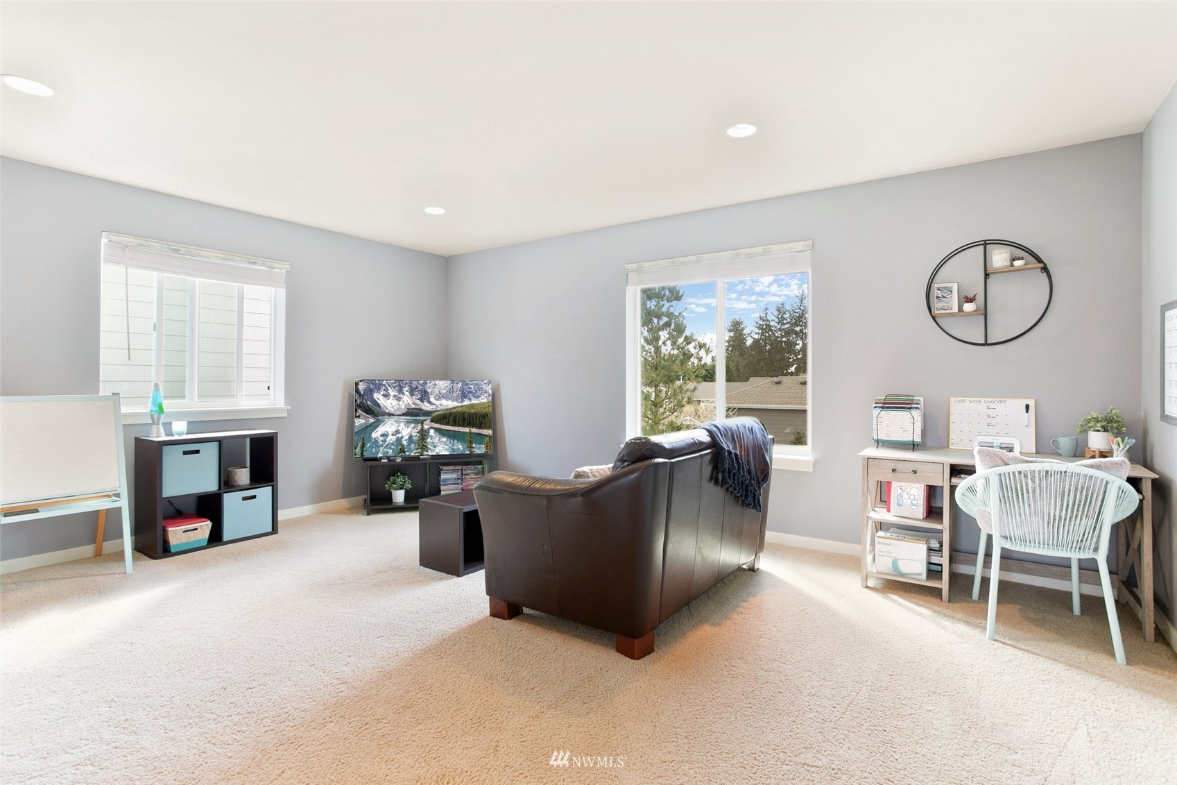 21804 42 Avenue Southeast Bothell, WA 98021 - Photo 21 of 33 a living room with furniture a fireplace and a large window