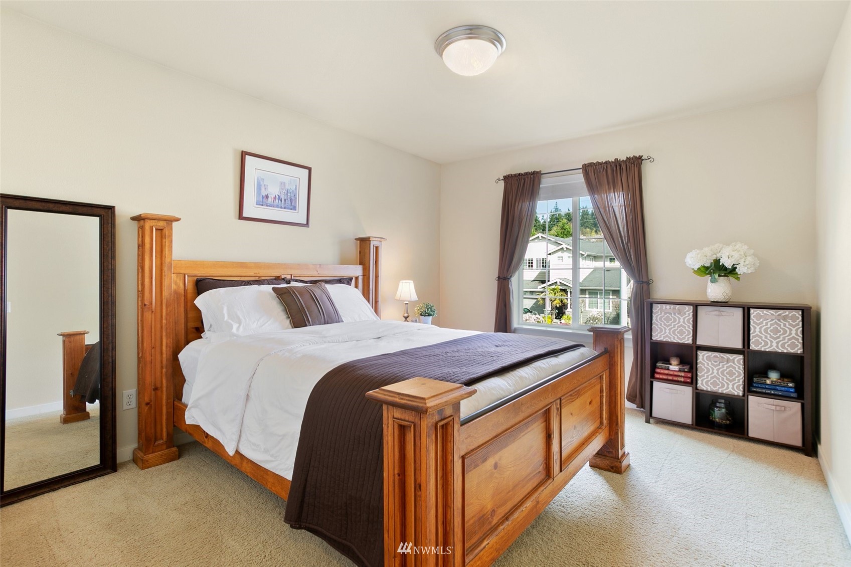 21804 42 Avenue Southeast Bothell, WA 98021 - Photo 22 of 33 a spacious bedroom with a bed and a window