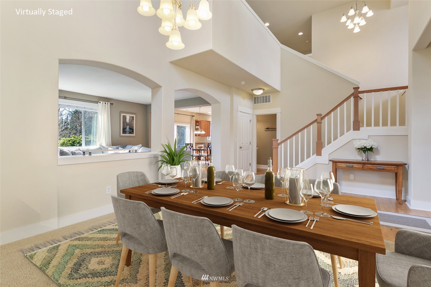 21804 42 Avenue Southeast Bothell, WA 98021 - Photo 5 of 33 a view of a dining room with furniture and a chandelier