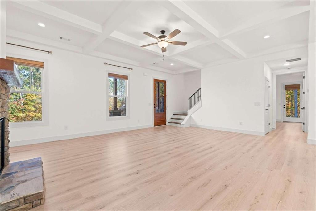 51 Post Oak Trace Villa Rica, GA 30180 - Photo 13 of 54 a view of a livingroom with wooden floor and a ceiling fan