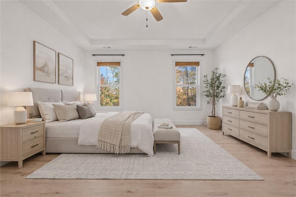 51 Post Oak Trace Villa Rica, GA 30180 - Photo 23 of 54 a bedroom with bed and a chandelier