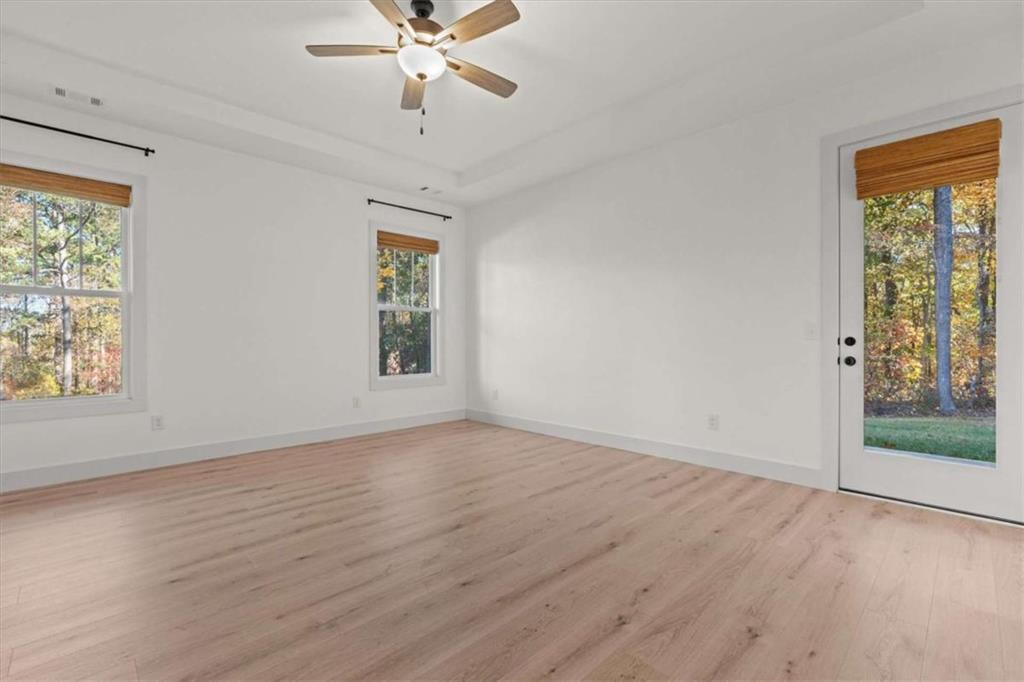 51 Post Oak Trace Villa Rica, GA 30180 - Photo 25 of 54 a view of an empty room with wooden floor and a window