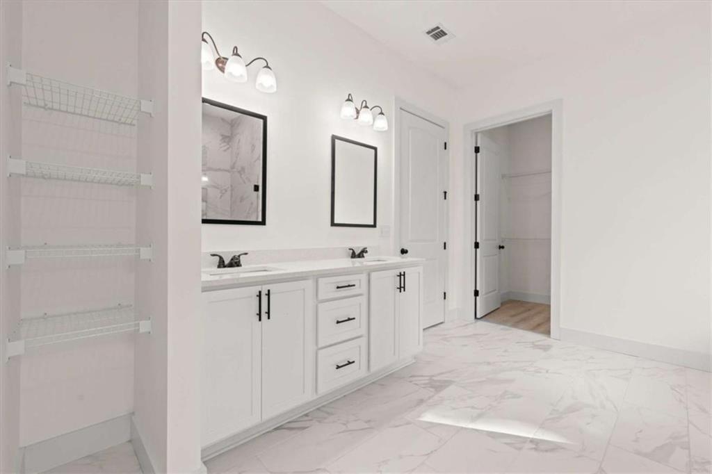 51 Post Oak Trace Villa Rica, GA 30180 - Photo 28 of 54 a spacious bathroom with double sink and a mirror