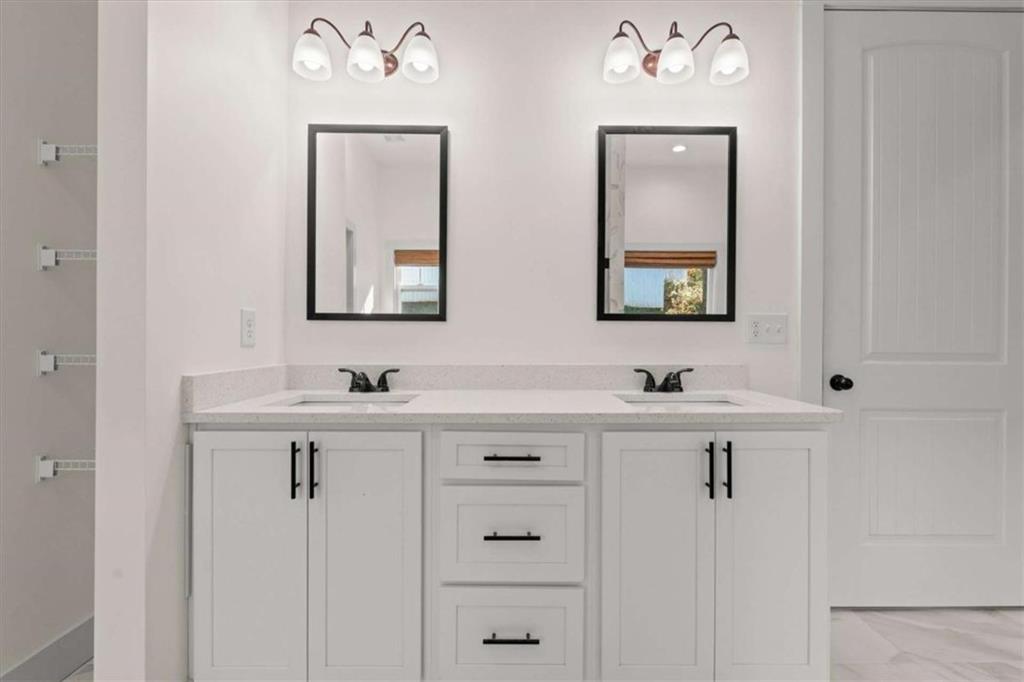 51 Post Oak Trace Villa Rica, GA 30180 - Photo 29 of 54 a bathroom with a sink and a mirror