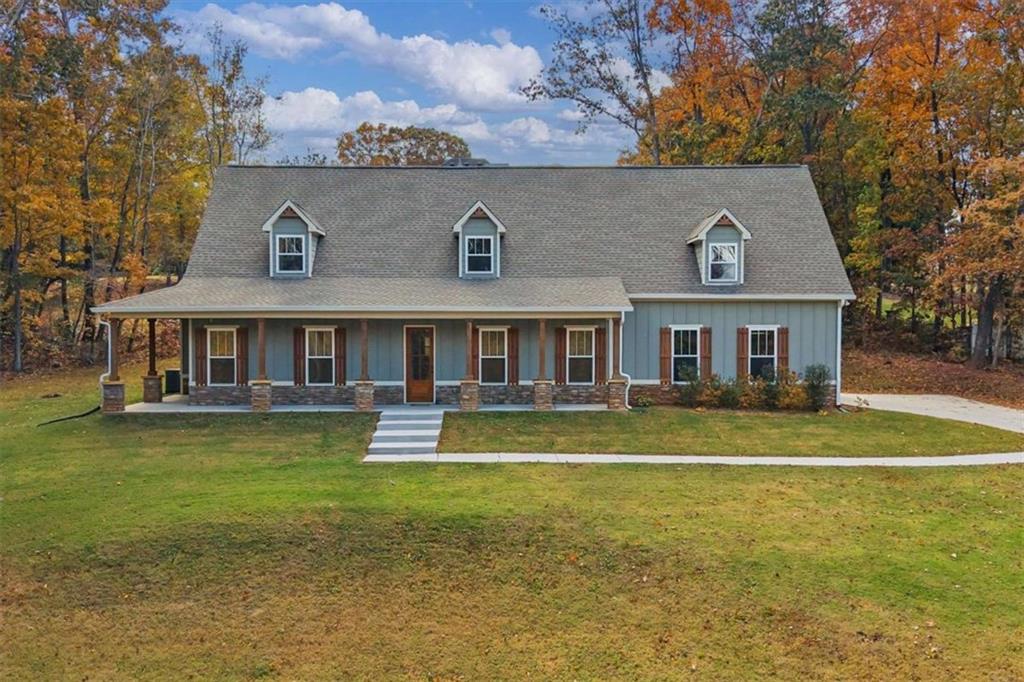 51 Post Oak Trace Villa Rica, GA 30180 - Photo 3 of 54 a front view of a house with swimming pool having outdoor seating