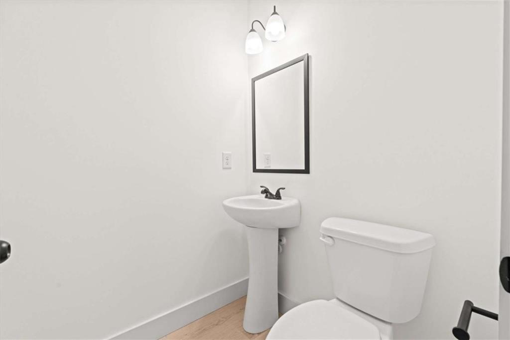 51 Post Oak Trace Villa Rica, GA 30180 - Photo 32 of 54 a bathroom with a toilet a sink and mirror