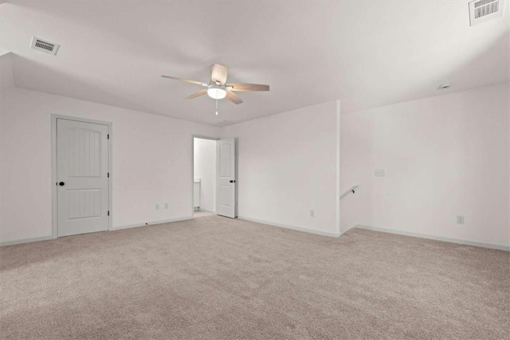 51 Post Oak Trace Villa Rica, GA 30180 - Photo 37 of 54 a view of an empty room with a ceiling fan